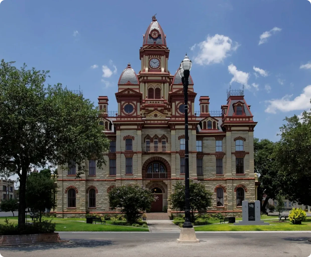 Historic courthouse building under blue sky.